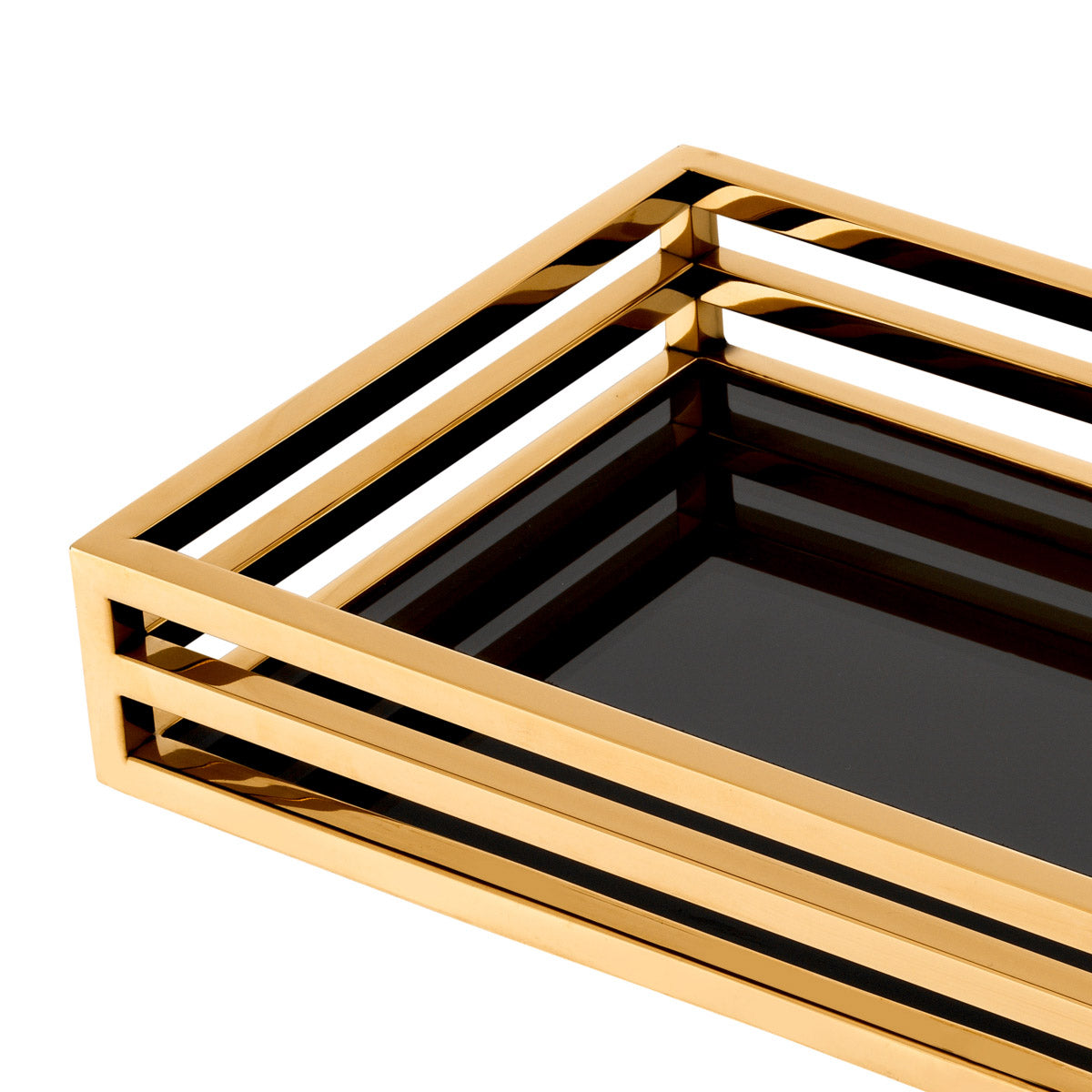 Eichholtz Tray Ersa table arrangements. Featuring a black glass bottom shelf and open-sided gold finish surround, this rectangular