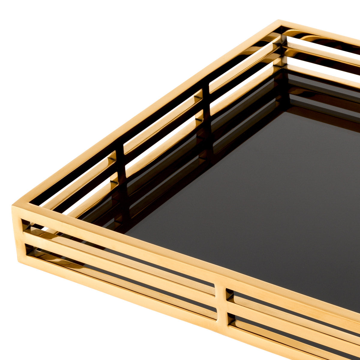 Eichholtz Tray Giacomo table arrangements. Featuring a black glass bottom shelf and open-sided gold finish surround, this rectangular