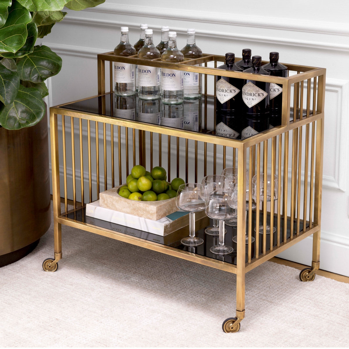 Eichholtz Trolley Rutherford brass finish adds a touch of antique allure, while the smoked glass creates a hint