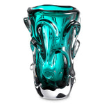 Eichholtz Vase Aila L Handblown from turquoise glass and embellished with arc-shaped decorations, Vase Aila is a perfect fit