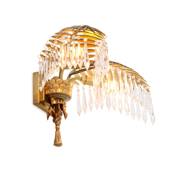 Eichholtz Wall Lamp Hildebrandt Showcasing cascading droplets of crystal glass, the Hildebrandt Wall Lamp is wonderful for adding a
