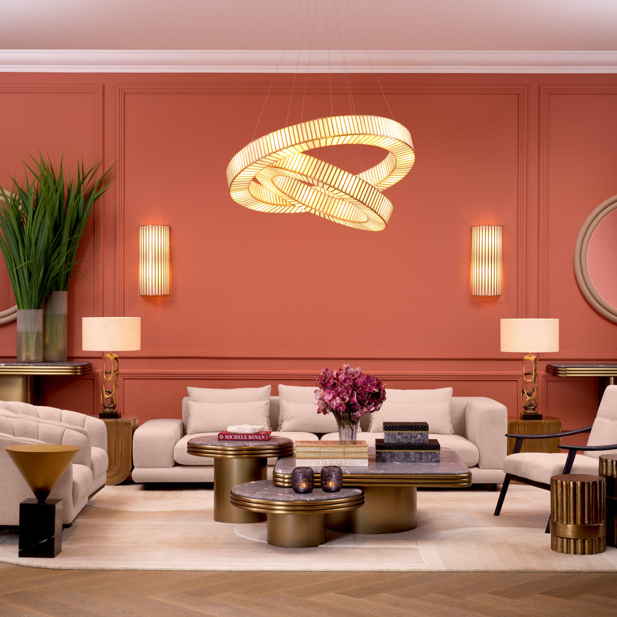 Eichholtz Wall Lamp Monari with its signature antique brass finish. Perfect for any room, the handmade glass columns capture