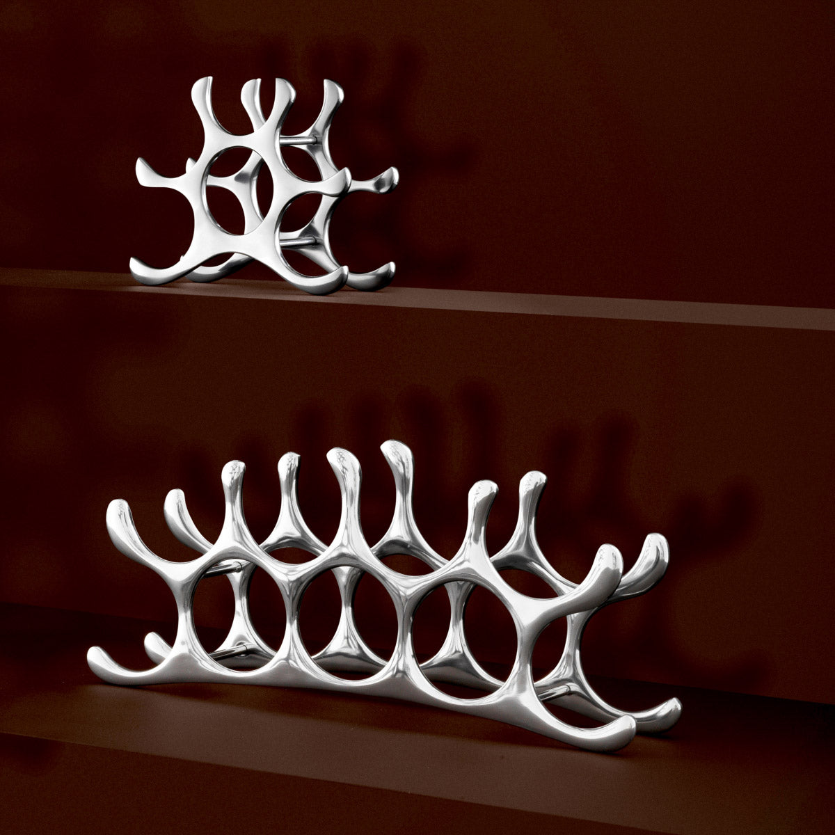 Eichholtz Wine Rack Alboran M Rack. Comprised of a sleek polished aluminium finish frame, it showcases a contemporary design and